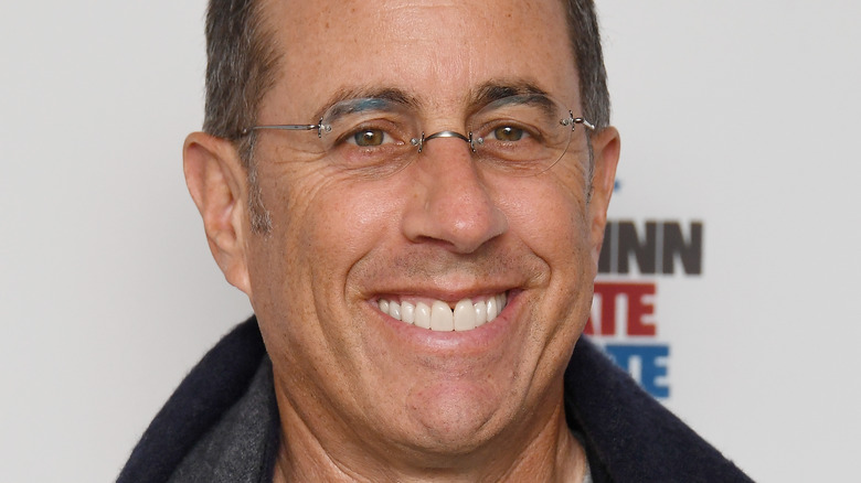 Jerry Seinfeld smiling with glasses 
