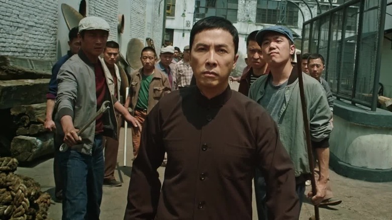 Donnie Yen as Ip Man walking away from thugs in Ip Man 3 (2015)