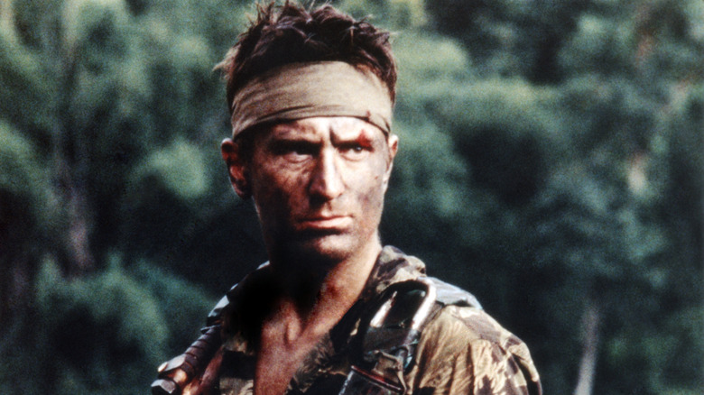 Mike standing near the woods in The Deer Hunter (1978)