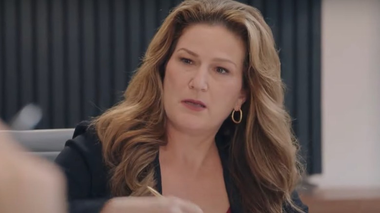 Ana Gasteyer as Katherine looking skeptical in American Auto