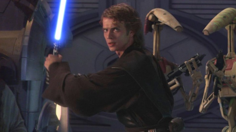 Anakin Skywalker holding his lightsaber