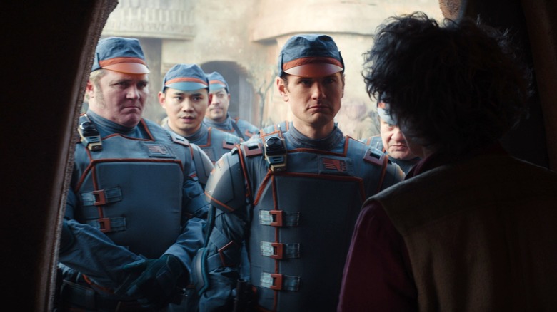Kyle Soller standing with soldiers in Andor