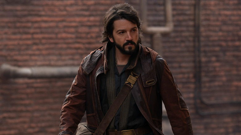 Cassian walking in alley