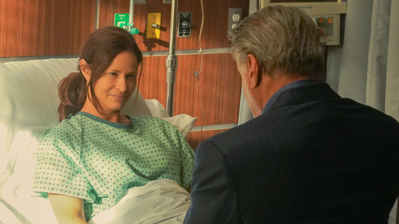 Dwight comforts Stacy in hospital bed