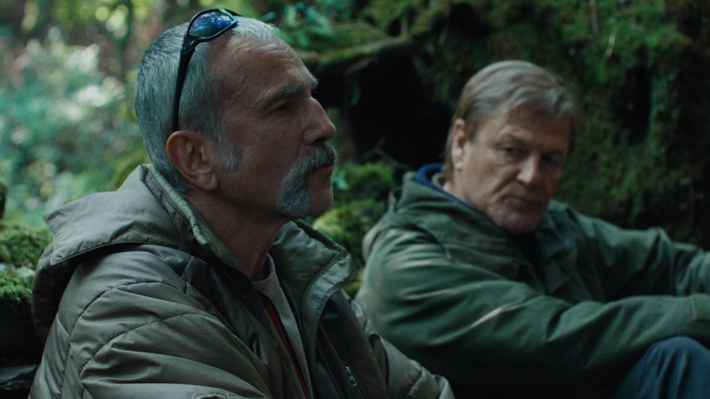 Ray and Jem sit in the woods in "Anemone" (2025)