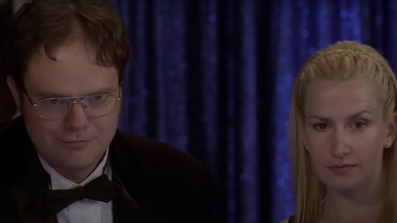 Angela and Dwight smirking