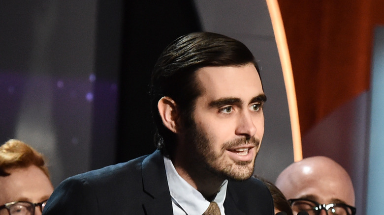 Jeff Loveness speaking onstage at the Oscars