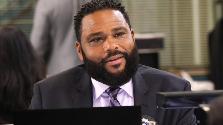 Anthony Anderson sitting at desk 