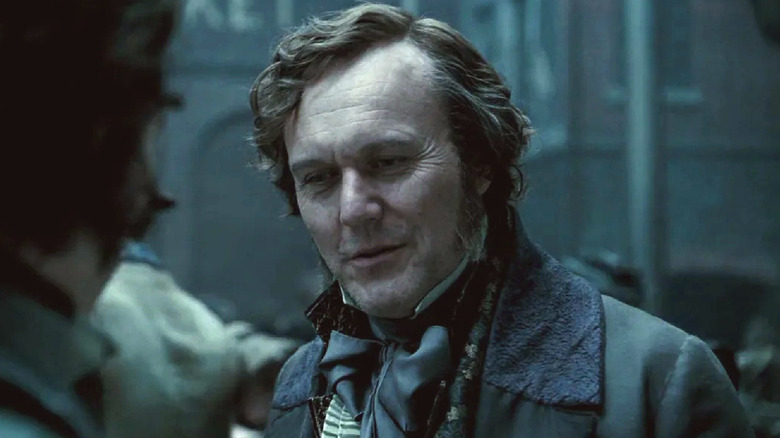 The well-dressed gentleman compliments Sweeney Todd in 