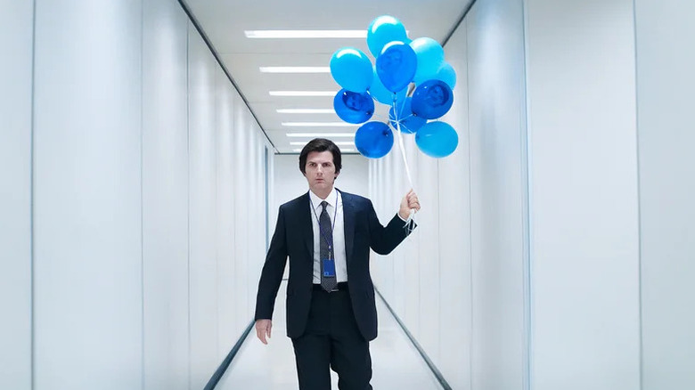 Mark S. holding a bunch of blue balloons on Severance