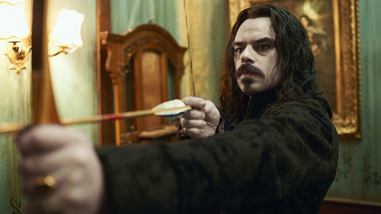 Jemaine Clement with arrow