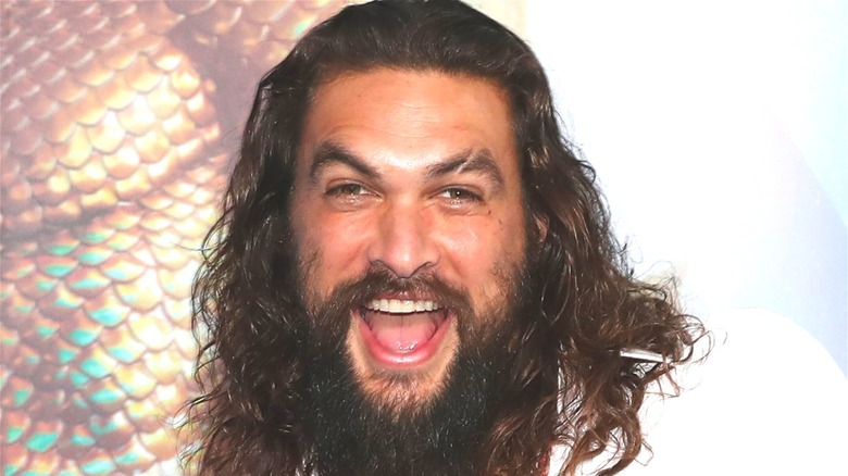 Jason Momoa mouth open smiling