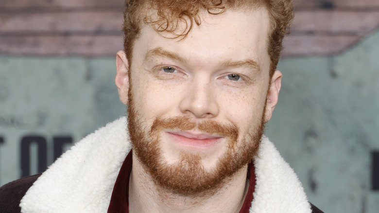 Cameron Monaghan smirks