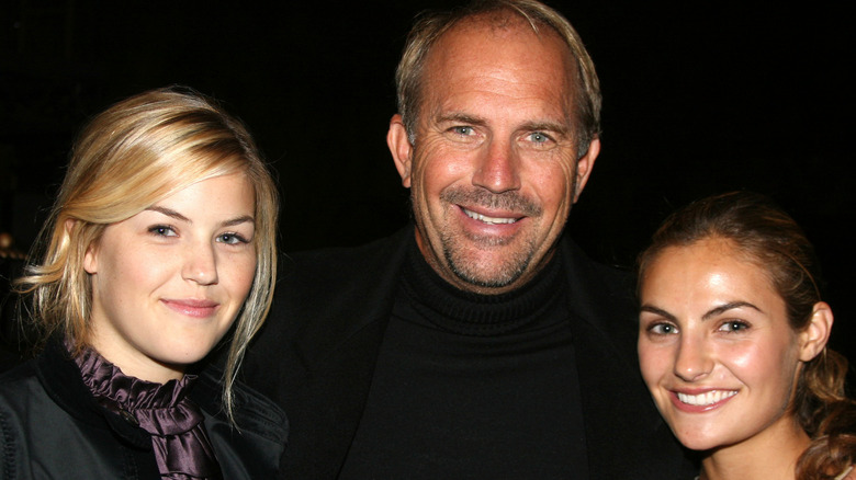 Kevin, Annie, and Lily Costner smiling