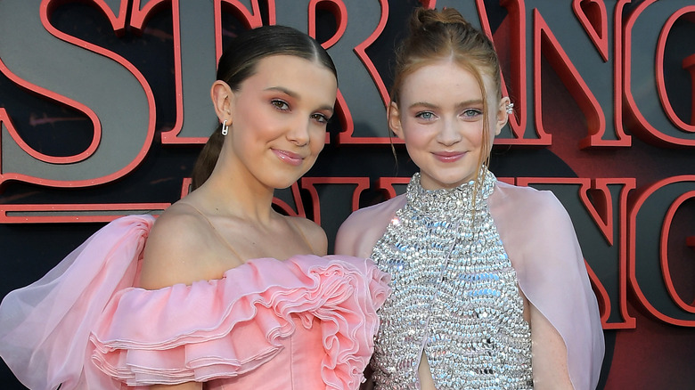 Millie Bobby Brown and Sadie Sink smiling