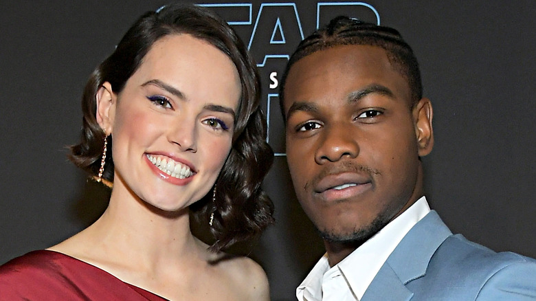 Ridley and Boyega posing for the camera