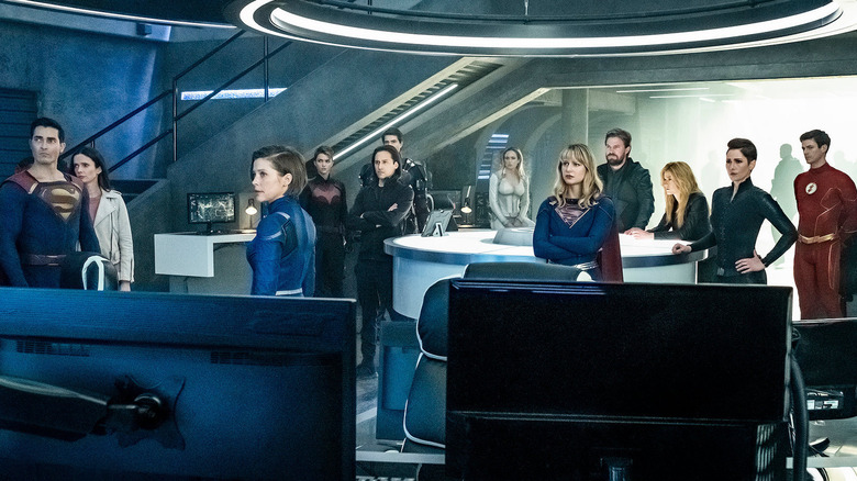 Heroes listening together at a meeting on Supergirl (2015-2021)