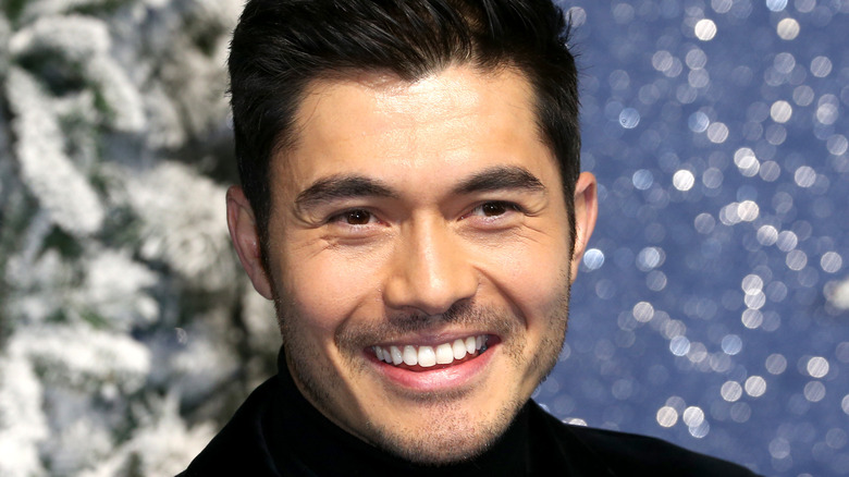 Henry Golding posing