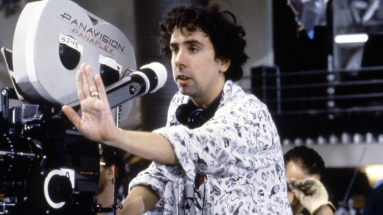 Tim Burton sits behind the camera on the set of Batman Returns