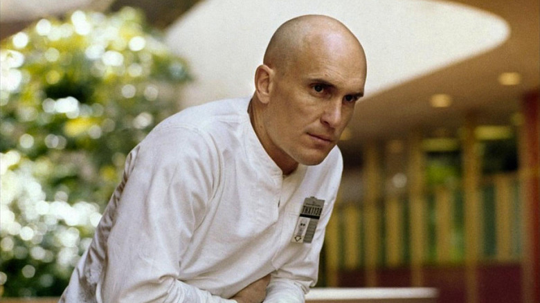 THX 1138 walks through a garden in "THX 1138" (1971)