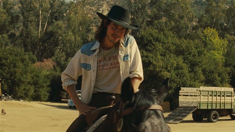 Tex smiling on horseback