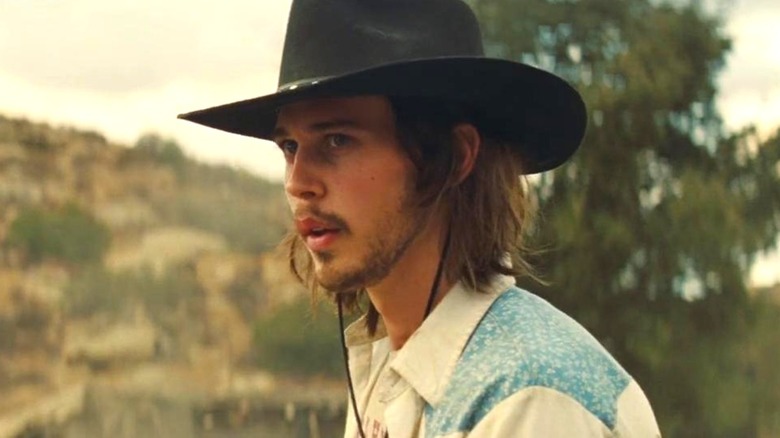 Tex looks concerned in cowboy hat