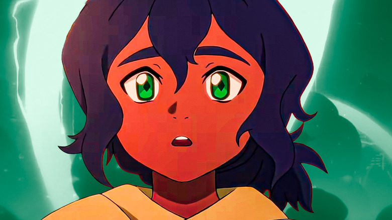 Pavi looking shocked with green energy behind her in Avatar: Seven Havens (2026)