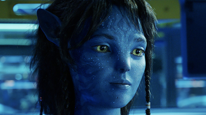 Kiri smiling in a lab in Avatar: The Way of Water