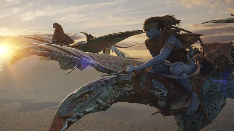 Jake and Neytiri flying on creatures