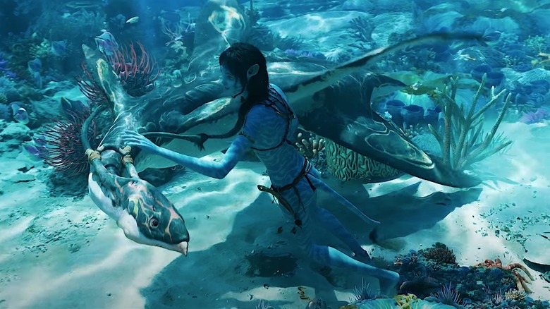 Na'vi swimming with creatures