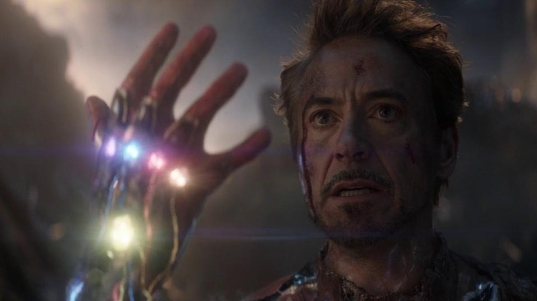 Tony Stark with his hand raised in Avengers: Endgame