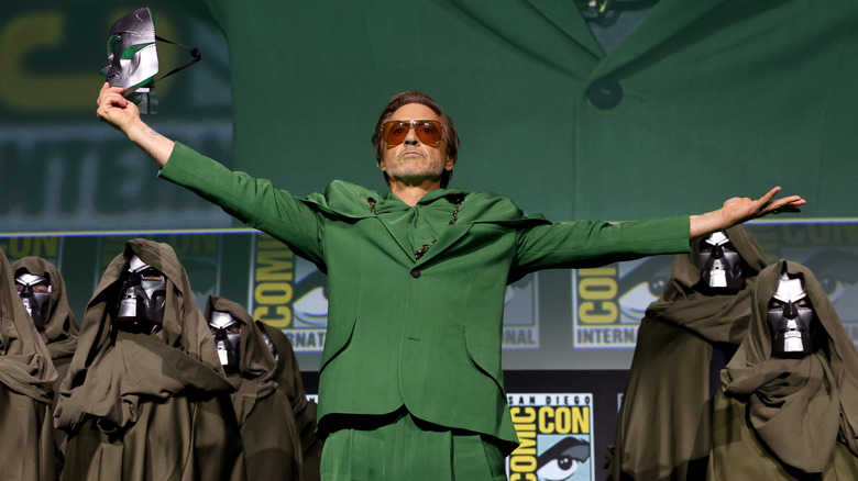 Robert Downey Jr. holds a Doom mask onstage at San Diego Comic-Con in 2024