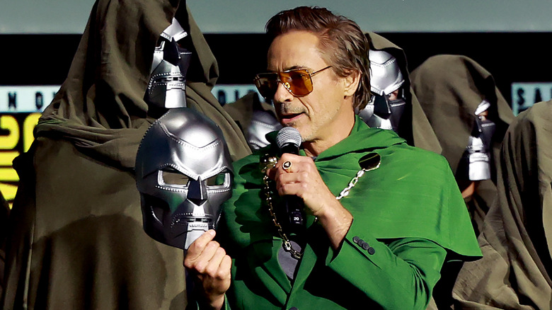 Robert Downey Jr. holds a Doom mask onstage at San Diego Comic-Con in 2024