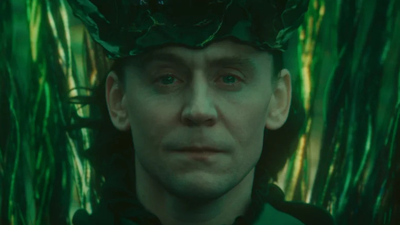 Loki surrounded by green tendrils on Loki