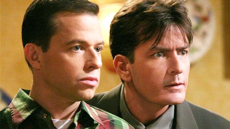 Charlie and Alan looking at something together in 