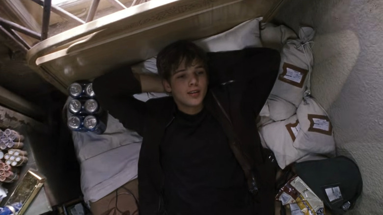 David Rice lying in bed in "Jumper" (2008)