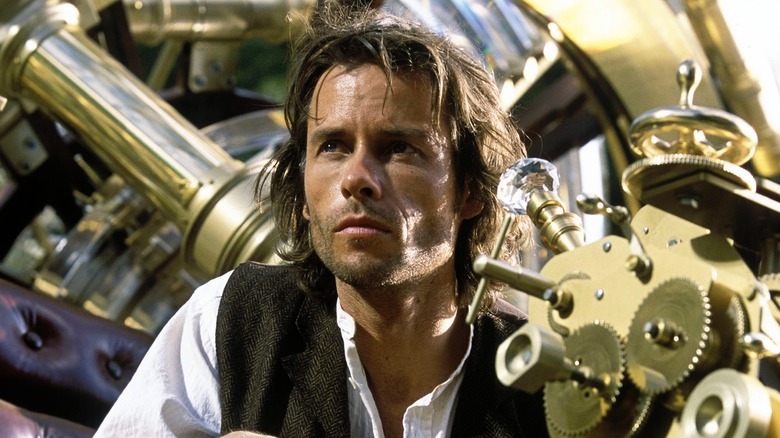 Dr. Alexander Hartdegen sitting in his device in "The Time Machine" (2002)