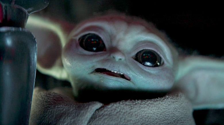 Baby Yoda showing sharp teeth