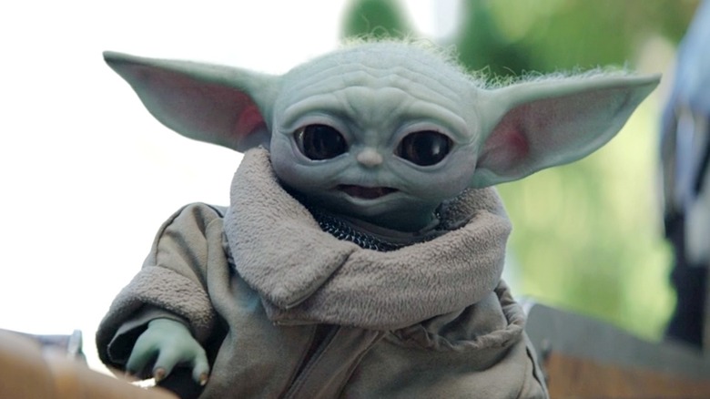 Confused Baby Yoda wearing warm coat