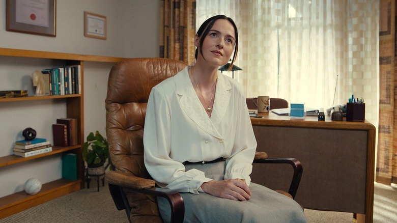 Mary looking concerned in her office in Backrooms
