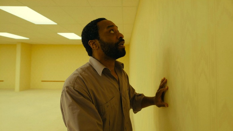 Clark looking up at a wall in Backrooms