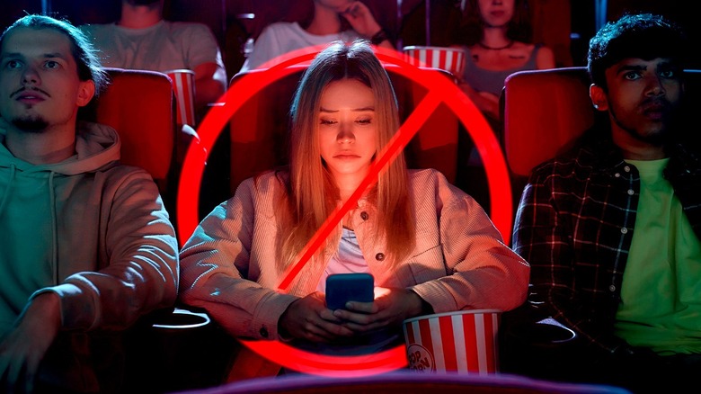 Girl on her phone at the movie theater
