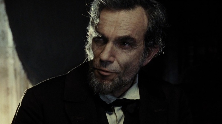 Abraham Lincoln standing in front of window in 