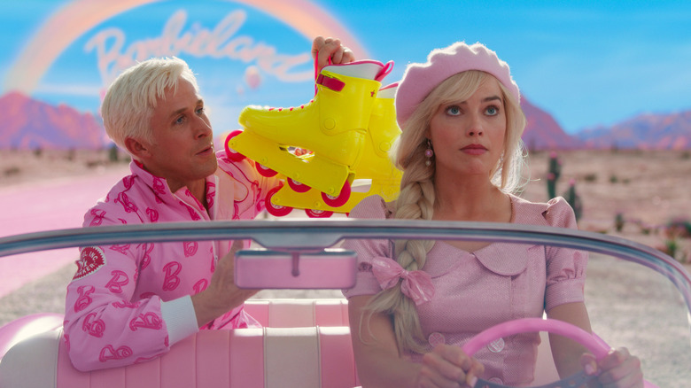 Ken waving his roller blades at Barbie