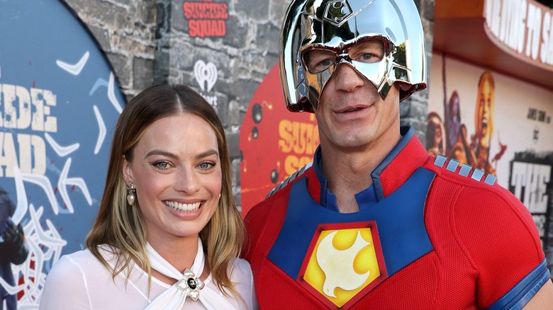 Margot Robbie and John Cena in Peacemaker costume