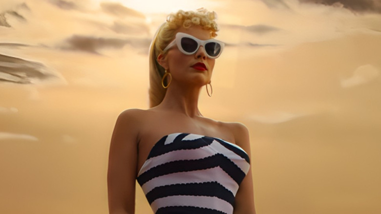 Barbie stands on sand dune