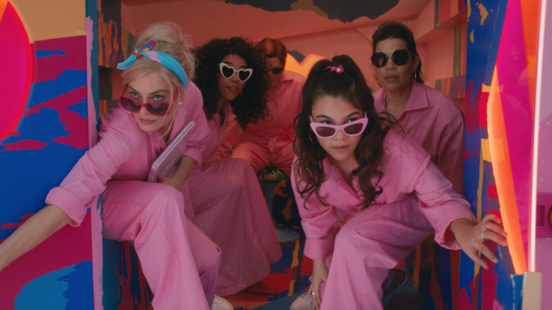 Barbies in pink jumpsuits and sunglasses