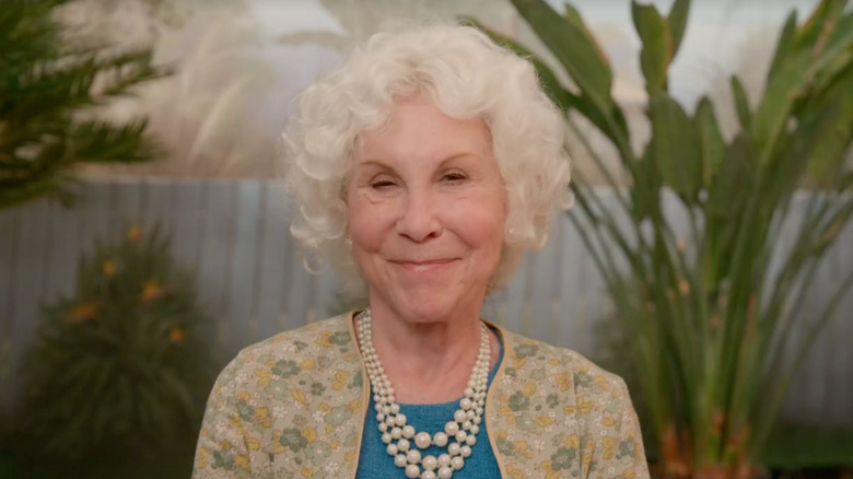 Ruth smiling wearing pearls