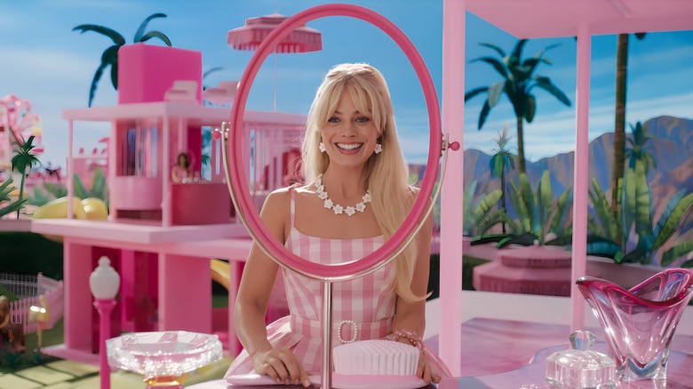 Barbie looking through mirror