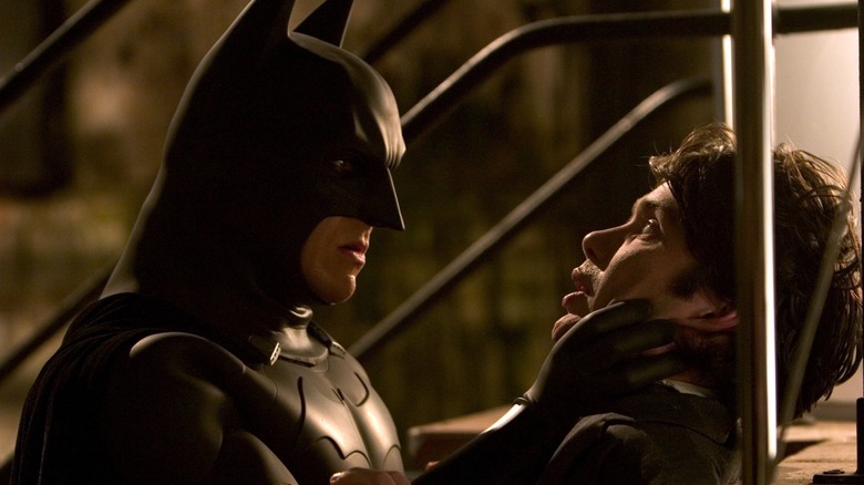 Christian Bale pinning down a criminal